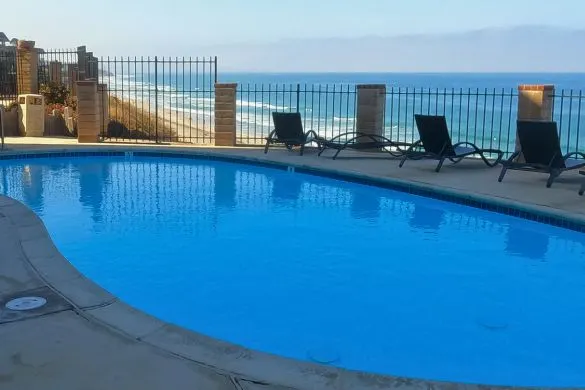View looking over Solana Beach oceanfront condo swimming pool south toward Del Mar.