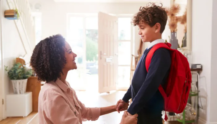 A mom and her son proud that they are done getting ready for the school day!