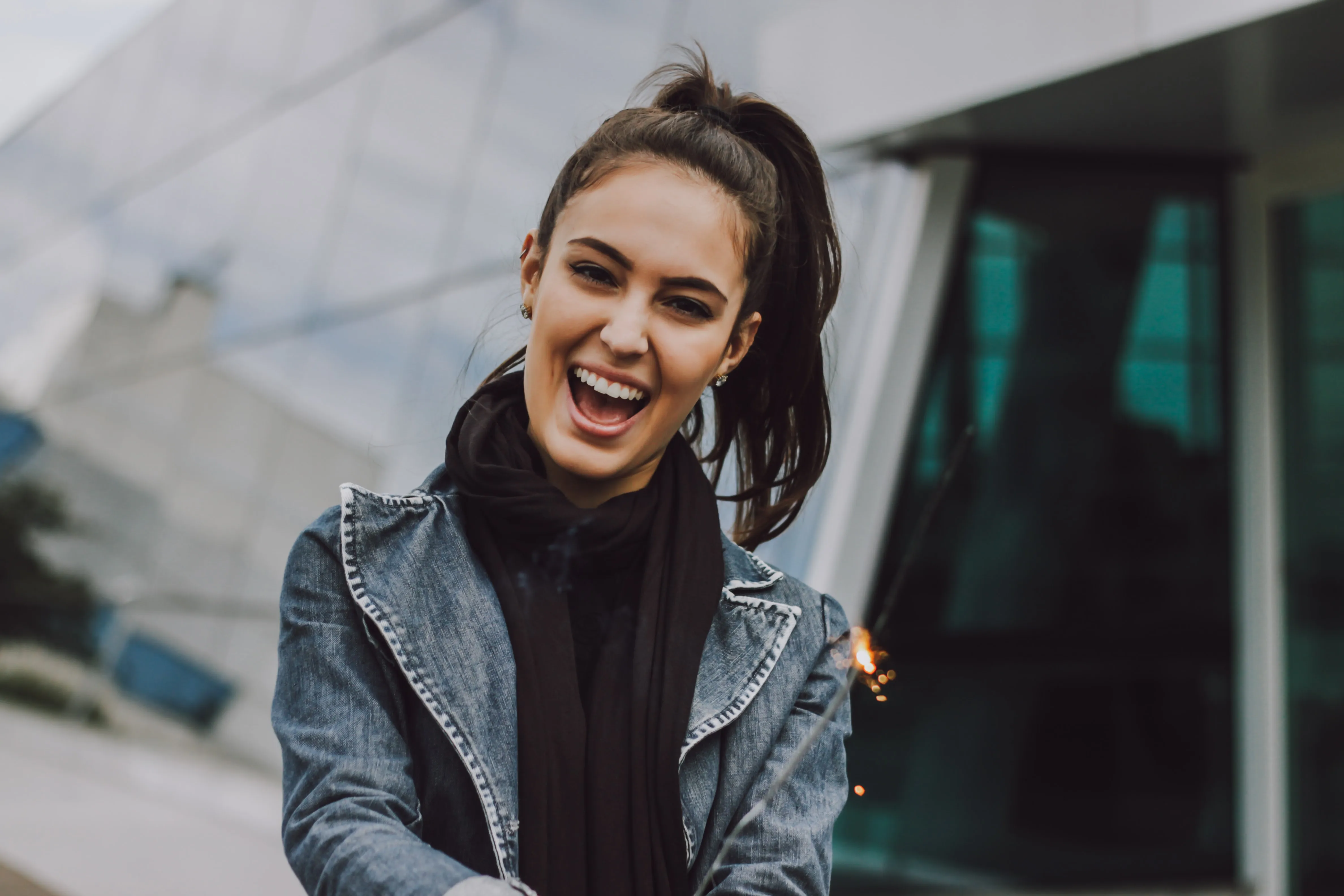 smiling woman in a jean jacket