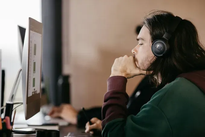 focus young man in front of computer