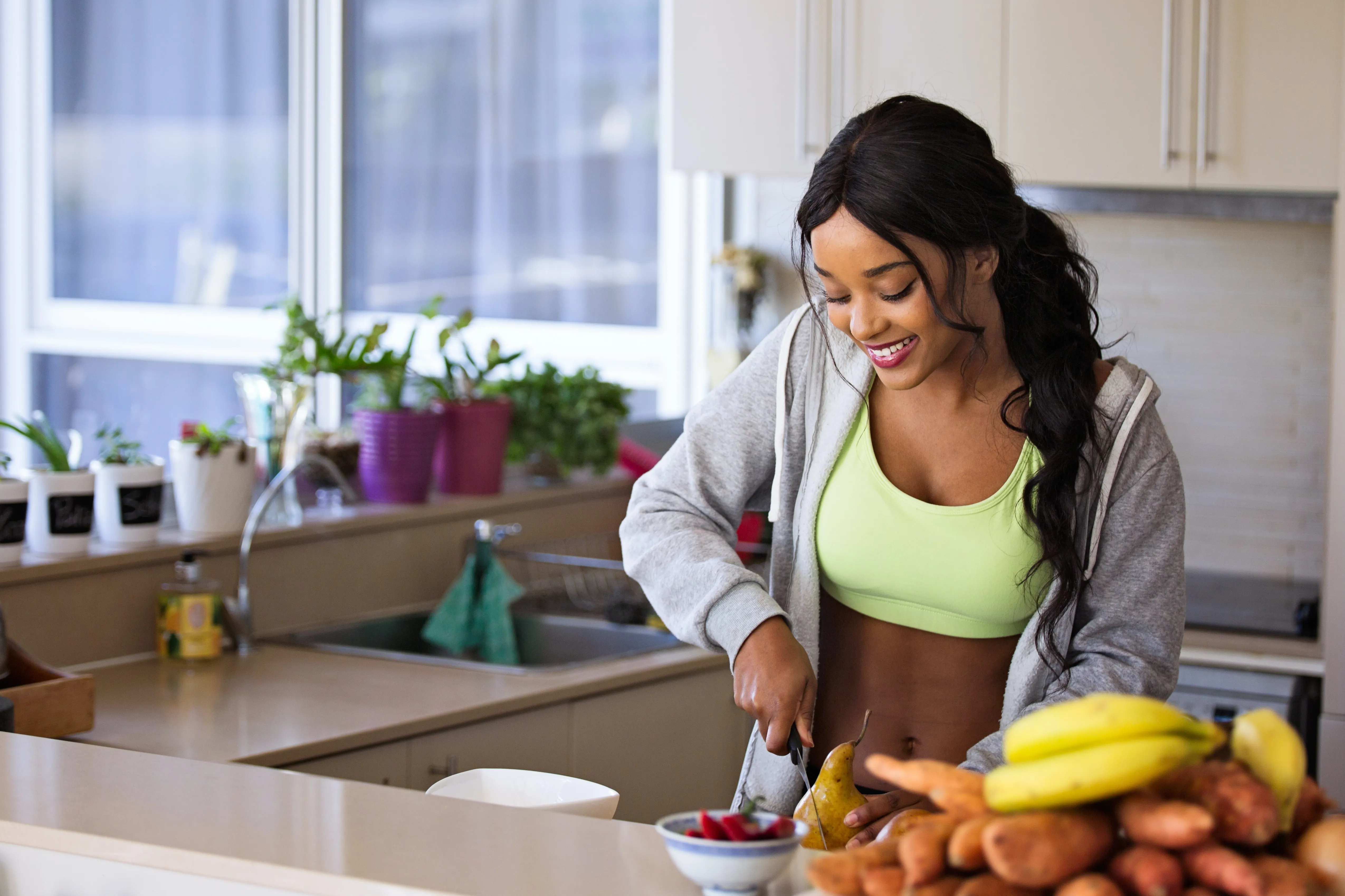 Healthy Slim Woman Chopping Fruit