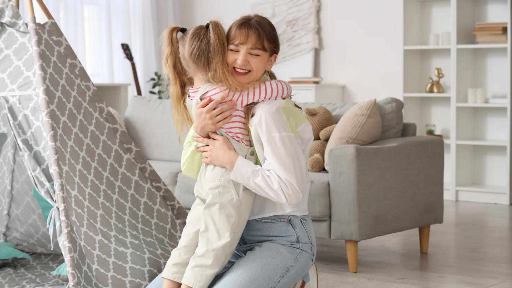 Nanny holding a little girl