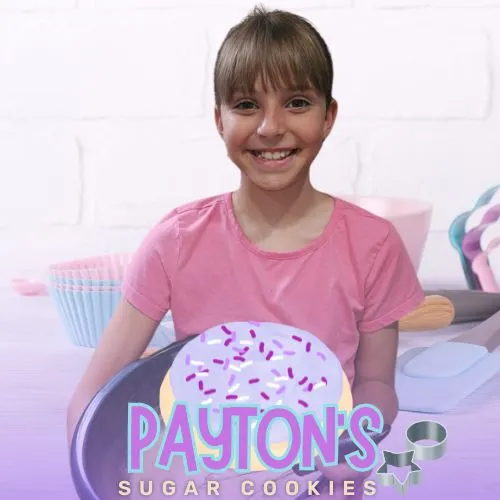 Payton presenting her homemade sugar cookies for Payton's Sugar Cookies