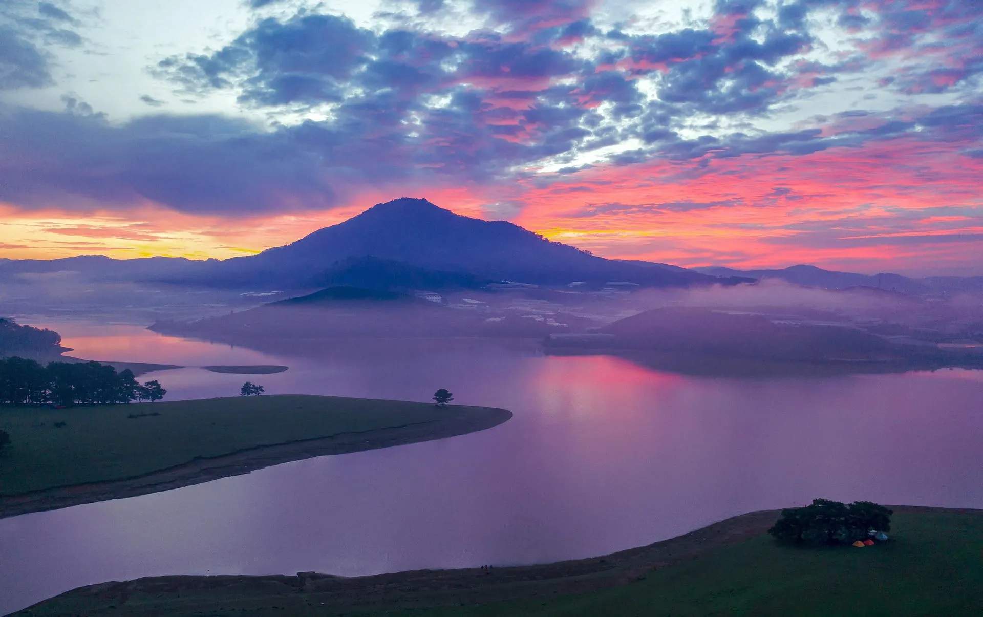 Sun set behind mountain and river