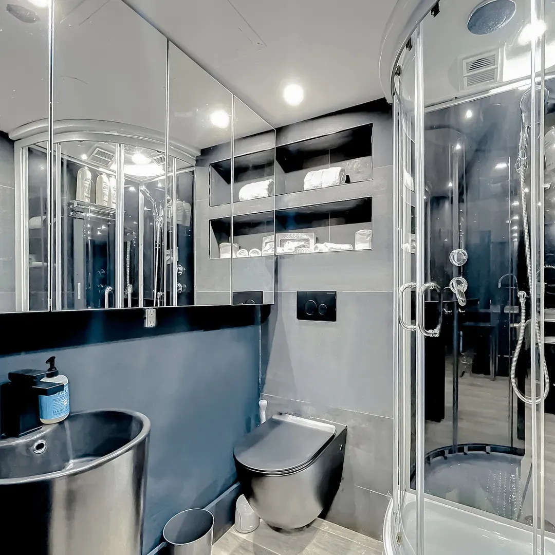 The main bathroom offers customizable lighting with dimmer switches to set your desired brightness from the vanity mirror to the shower area.