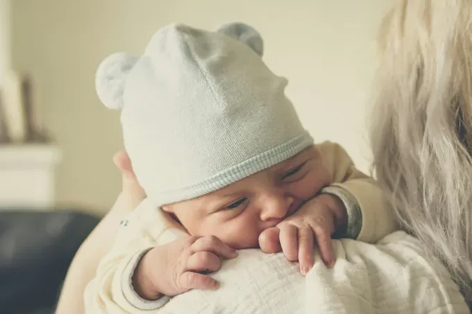 cute little baby in white baby gown