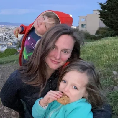 Erika Friday, the Ready Set Mom, with her two young children, eating cookies