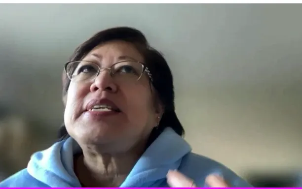 Karen Yee looking up in air as she remembers