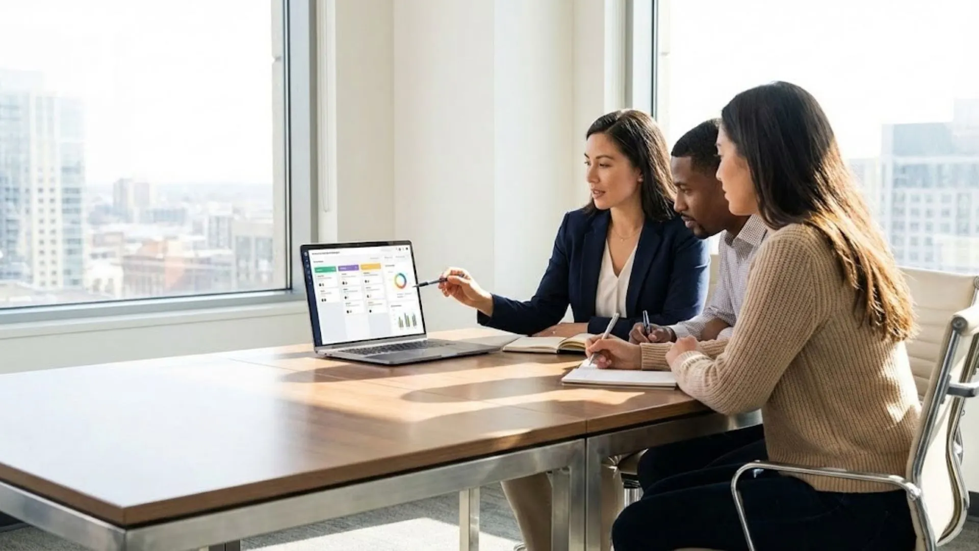 Team of professionals reviewing expert AI prompts on a laptop screen.
