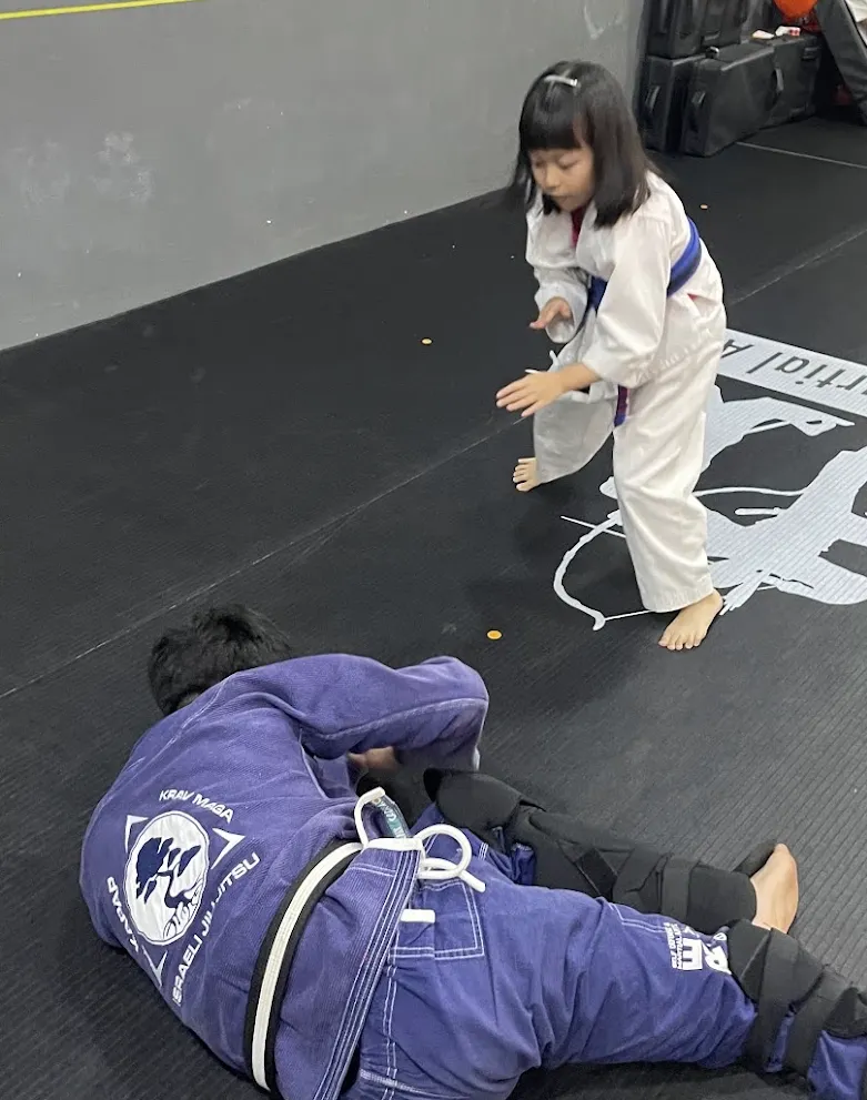 Child practising decision-making during self-defence training at CADRE Academy