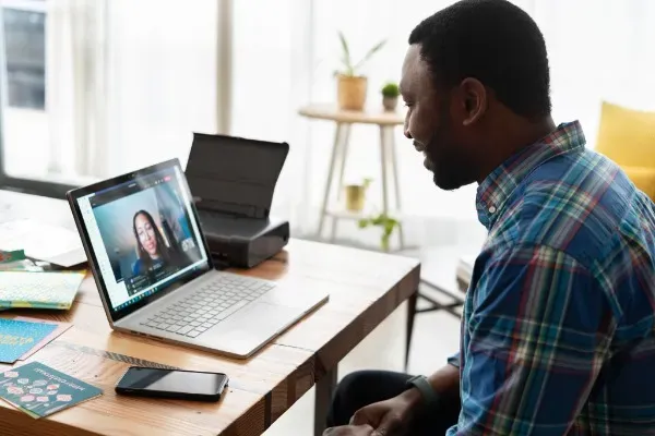 man sitting in front of a computer