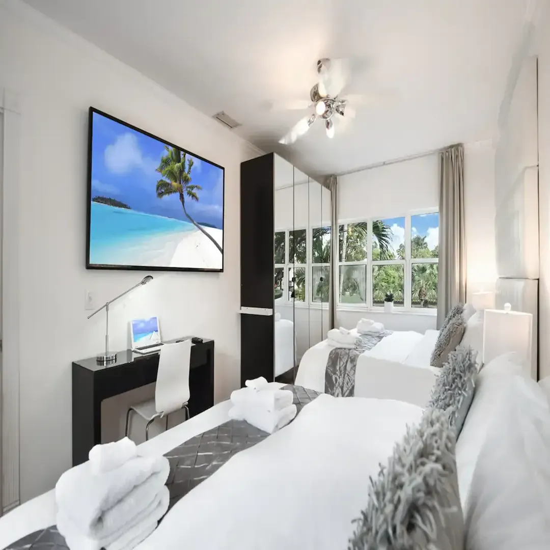 Master Bedroom en-suite with 2 King Size beds and 70 inch smart TVs