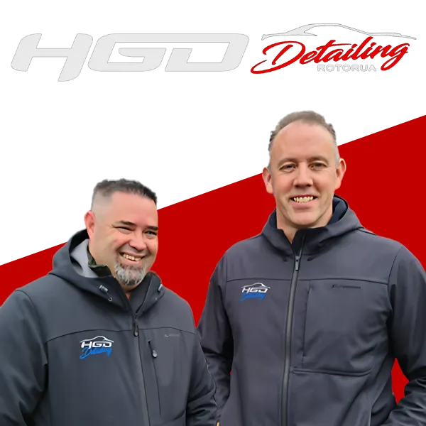 Two smiling men Dean and Steve, wearing dark jackets with the 