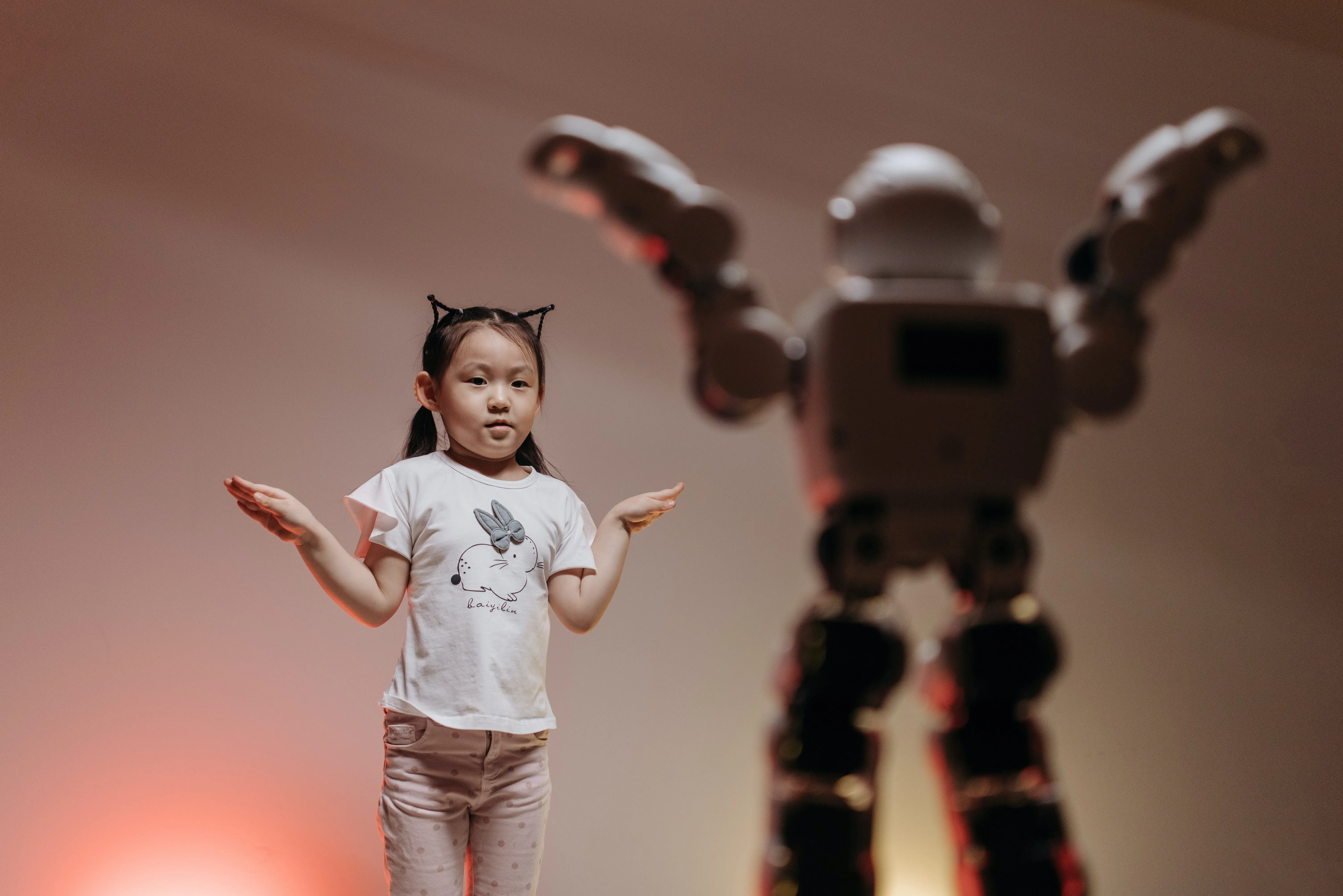 girl playing with robot toy