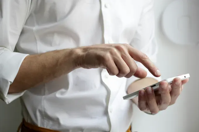 man in white shirt calculating