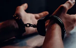 Hands cuffed and restrained 