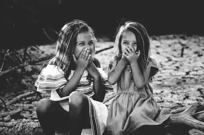 two girls laughing