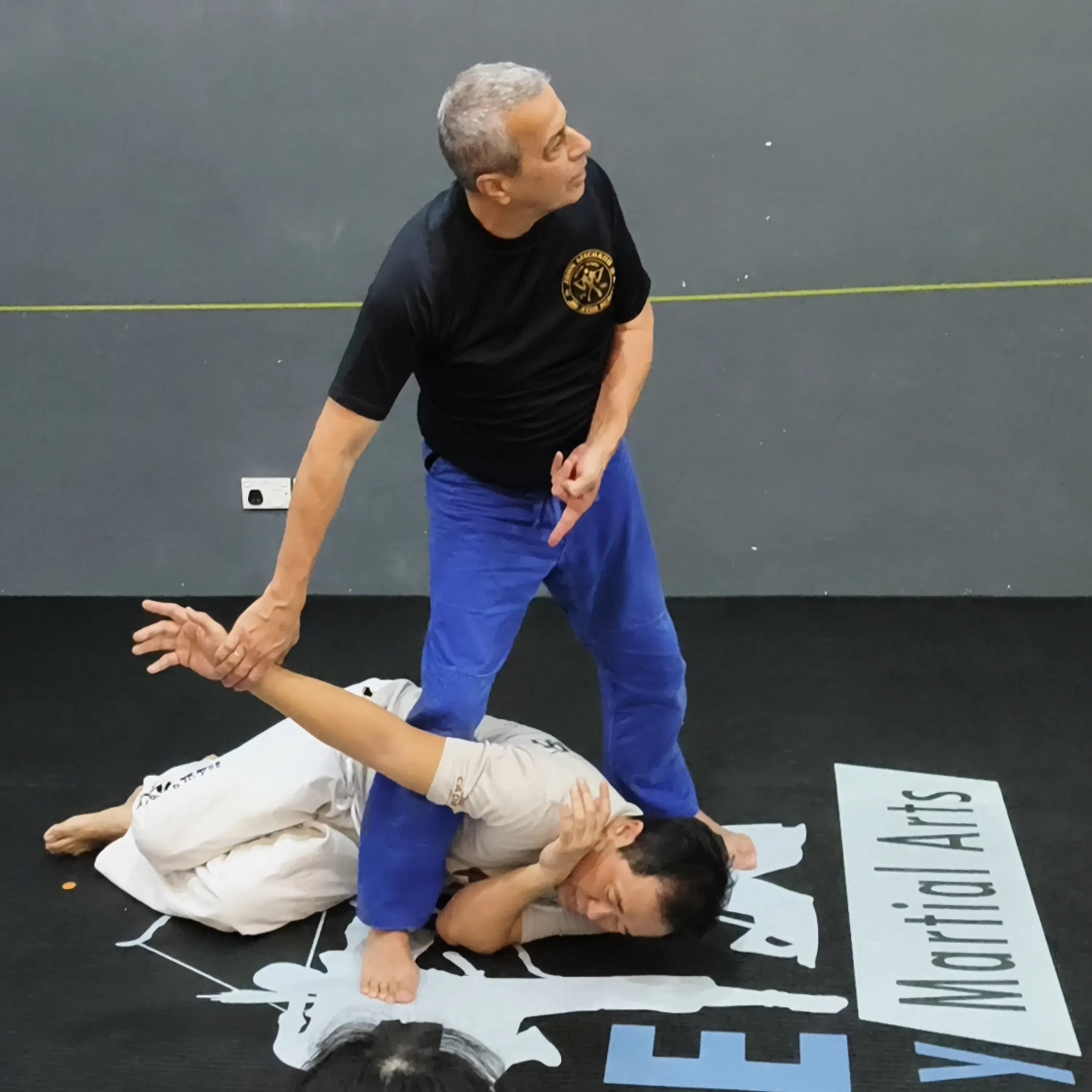 Integrated Jiujitsu Founder, Avi Nardia, demonstrating position and control principles during training at CADRE Academy.