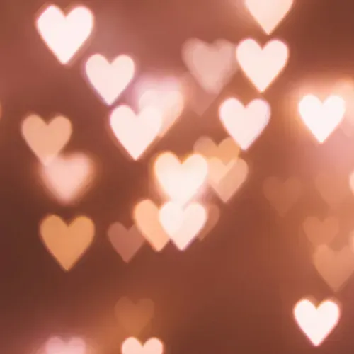 glowing hearts floating on red-pink background