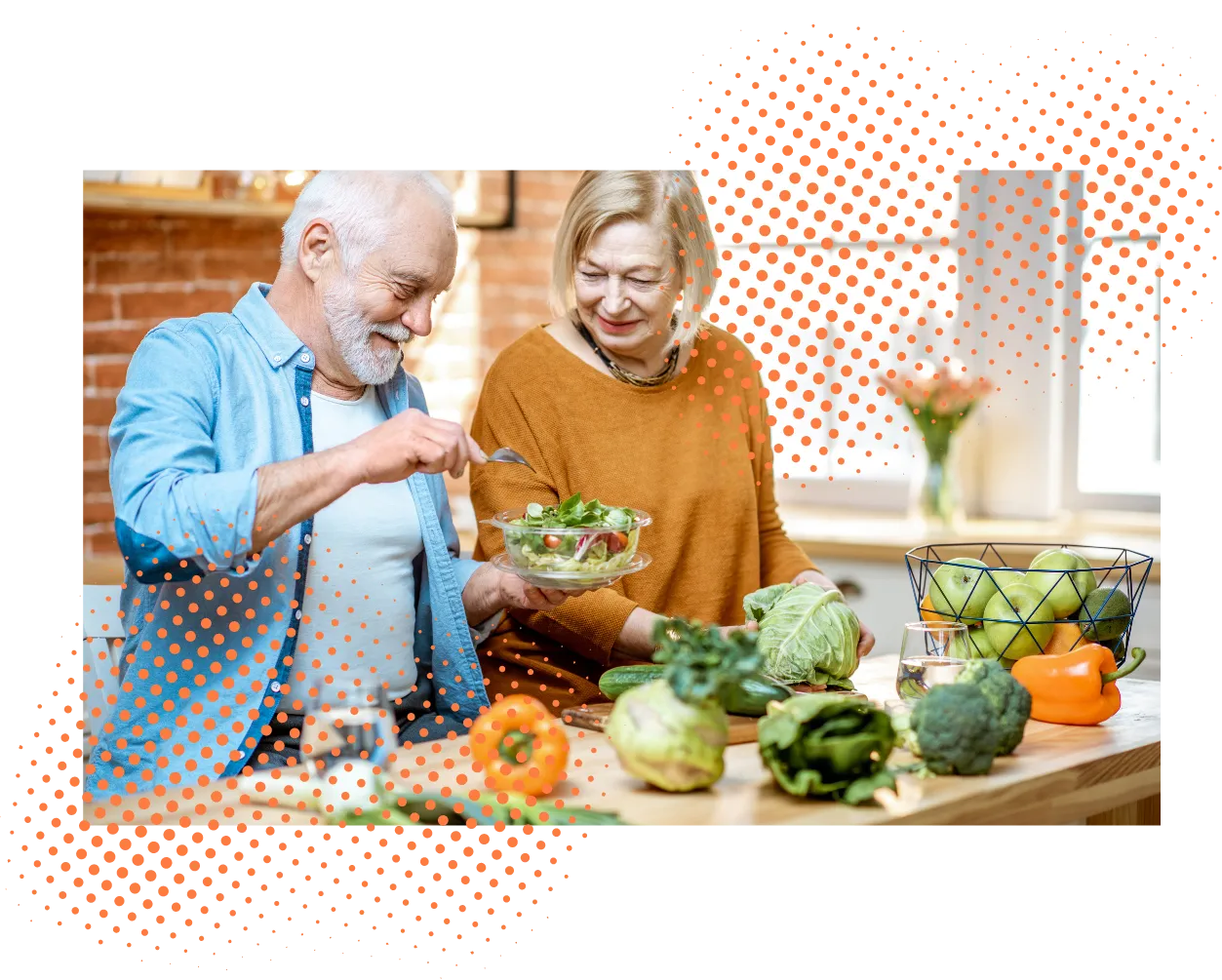 Man and woman in their golden years cooking a healthy meal together