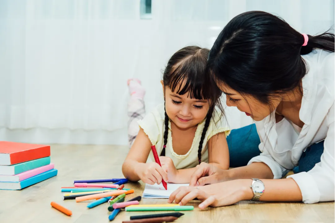 Mom and daughter coloring together, bonding, family, relaxation