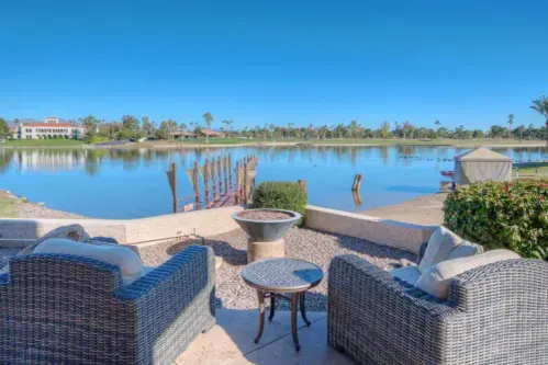 Lakefront & Golf View Dining: Experience a stunning Resort with fire pits, offering picturesque lakefront and golf course views. Enjoy privacy in a Private Villa with access to Resort Amenities, including the Resort Pool nearby.